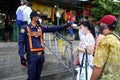 Security guard check temperature of customers at a public market during the Covid 19 virus outbreak