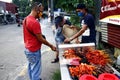 Street vendor sell assorted grilled pork and chicken innards barbecue at his makeshift food stall Royalty Free Stock Photo