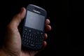 Old and used mobile phone with qwerty keyboard