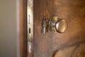 Antiqu keyhole and out of focus handle on a wooden door. Royalty Free Stock Photo