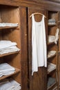 Antiquated bedroom with linen clothing Royalty Free Stock Photo