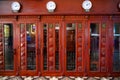 Antiquated red painted telephone boxes inside Ho Chi Minh Central Post Office. Historical Central Post Office of former Saigon. Royalty Free Stock Photo