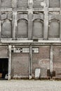 Antique abandoned brick and concrete warehouse facade. Norway