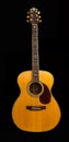 Antique Accoustic Guitar Yellow Spruce Top small pick guard all isolated on a black background