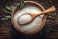 Antique allure Ladle rests in wooden bowl filled with coarse salt Royalty Free Stock Photo