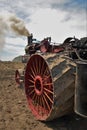 Antique Amish steam tractor engine preparing the field