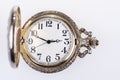 Antique analog pocket watch with hands and numbers