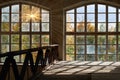 Antique arched window with view to autumnal landscape, bright sunshine.View through the window in autumn
