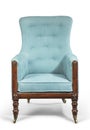 Antique arm chair light blue upholstery isolated on white background Royalty Free Stock Photo