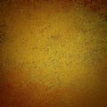 Antique background texture in gold brown and orange with grunge texture and black vignette border, old painted vintage wall Royalty Free Stock Photo