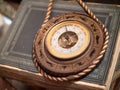 An antique barometer on a book Royalty Free Stock Photo