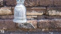 Antique bell on old brick wall background, vintage filter effect Royalty Free Stock Photo