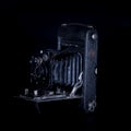 Antique bellows camera in moody light