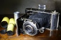 Antique bellows camera and original film