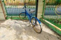 An antique bicycle was parked near the fence Royalty Free Stock Photo