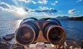 Antique binocular on rock in beach Royalty Free Stock Photo