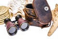 Antique binoculars with leather case , rope and star fish isolated on white