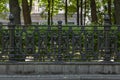 Antique black cast-iron fence with ornate ornament Royalty Free Stock Photo