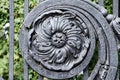 Antique black cast iron ornate lattice with dusty surface floral patterned elements. Old door grilles Royalty Free Stock Photo