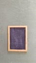 antique black chalkboard on green cloth background