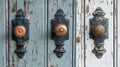 Antique black door plates with copper knobs. Classic door hardware on chipped paint door. Door handles. Concept of retro Royalty Free Stock Photo