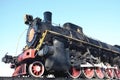 Antique black retro-train on track. A monument to the industrial achievements of the Soviet Unio Royalty Free Stock Photo