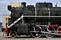 Antique black retro-train on track. A monument to the industrial achievements of the Soviet Unio