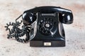 Antique black rotary phone on concrete background Royalty Free Stock Photo