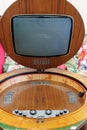 Antique Black and White TV set with Cathode Ray Tube Set in a Wooden Cabinet with a Folding Screen