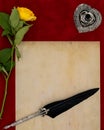 Vintage blank preachment, yellow rose, ornate silver quill stand and ornamented quill - Love letter concept Royalty Free Stock Photo