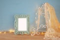 Antique blank victorian style frame on wooden table