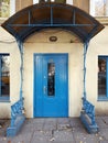 Antique blue door at retro porch of old building