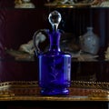 Antique blue glass vase in luxury interior. Royalty Free Stock Photo