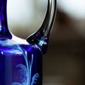 Antique blue glass vase in luxury interior. Royalty Free Stock Photo