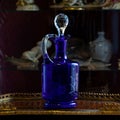 Antique blue glass vase in luxury interior. Royalty Free Stock Photo