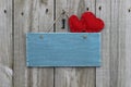 Antique blue sign with red hearts