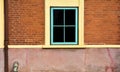 Antique blue wood window at red brick building. Royalty Free Stock Photo