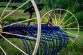 Antique blue and yellow hay rake