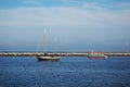 Antique boat and modern boat in Provincetown, MA