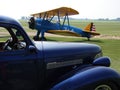 Antique Boeing Stearman PT-17 and 1940s Roadster