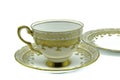 Antique bone china cup saucer and tea plate in gold painted flower design Royalty Free Stock Photo