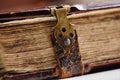 Antique book, with brass clasps. Fragment of an old book Royalty Free Stock Photo