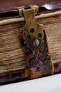 Antique book, with brass clasps. Fragment of an old book Royalty Free Stock Photo