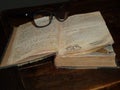 Antique book open on wooden table