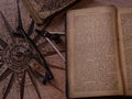 Antique books, antique map, compass, glasses and crystal, vintage mood. Red lighting Royalty Free Stock Photo