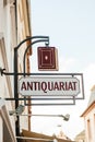 Antique bookstore sign - antiquariat Royalty Free Stock Photo