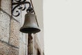 An Antique Brass Bell Hanging From A Wall Royalty Free Stock Photo