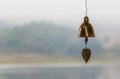 Antique brass bell, on river and mountain. Royalty Free Stock Photo