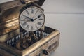 Antique brass box with old pendulum table clock Royalty Free Stock Photo