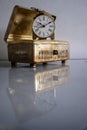 Antique brass box with old pendulum table clock Royalty Free Stock Photo